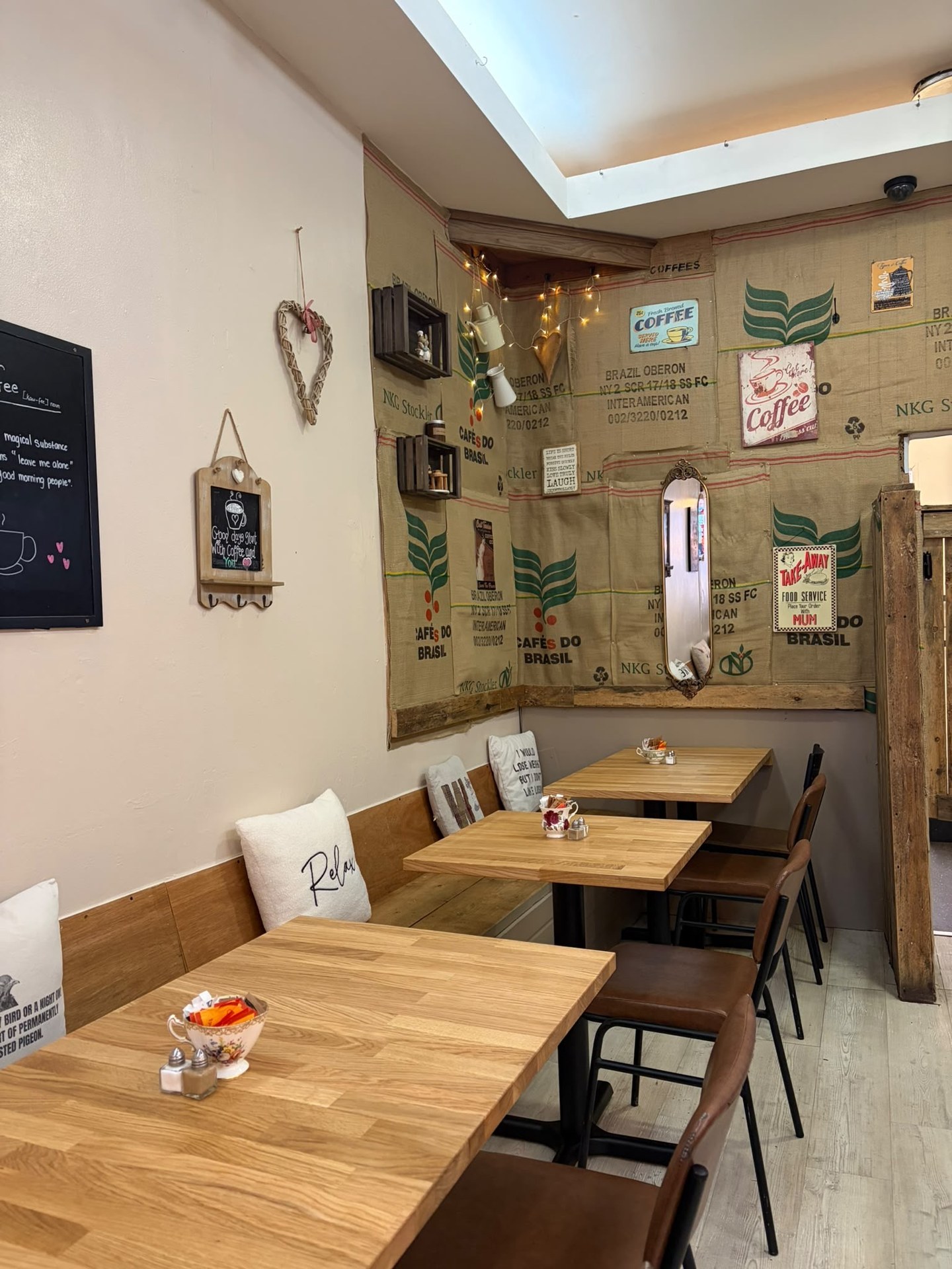 Corner seating with coffee sack wall decorations and warm fairy lights